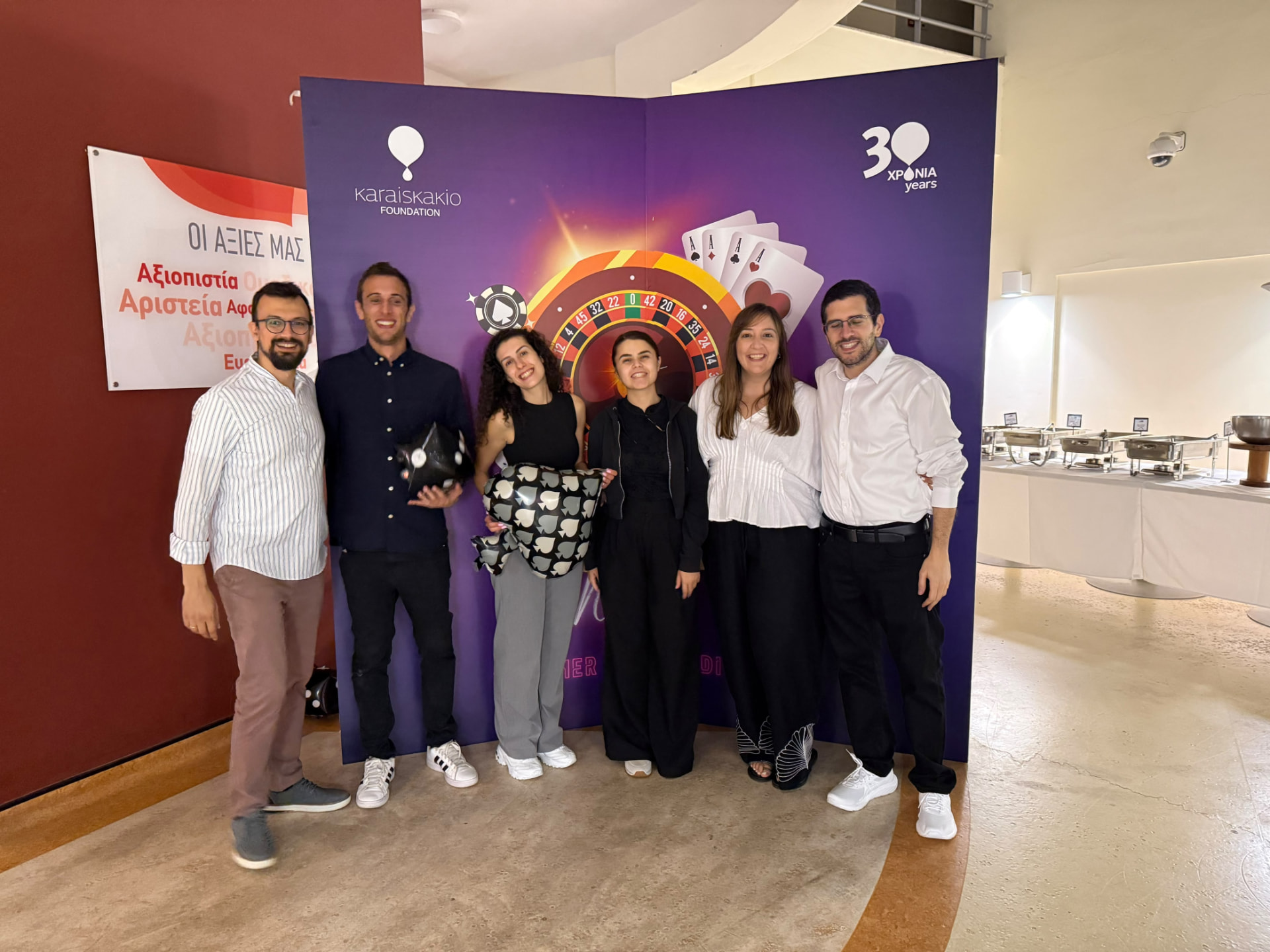 CMIT team members together at a Karaiskakio Foundation event